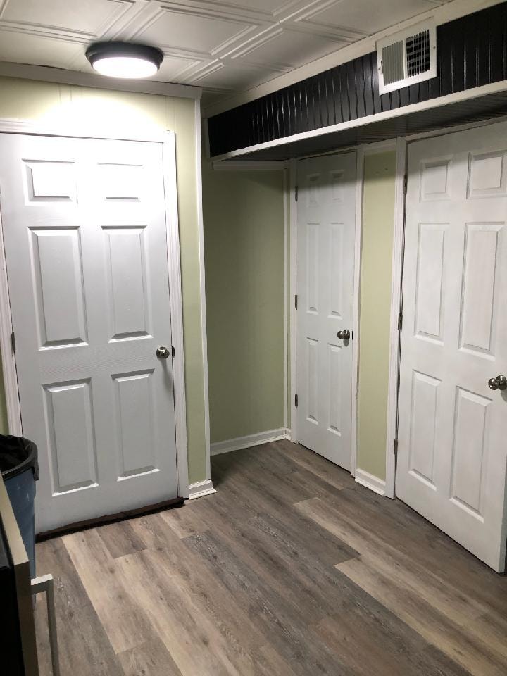 Small basement finish — storage closets with white panel doors