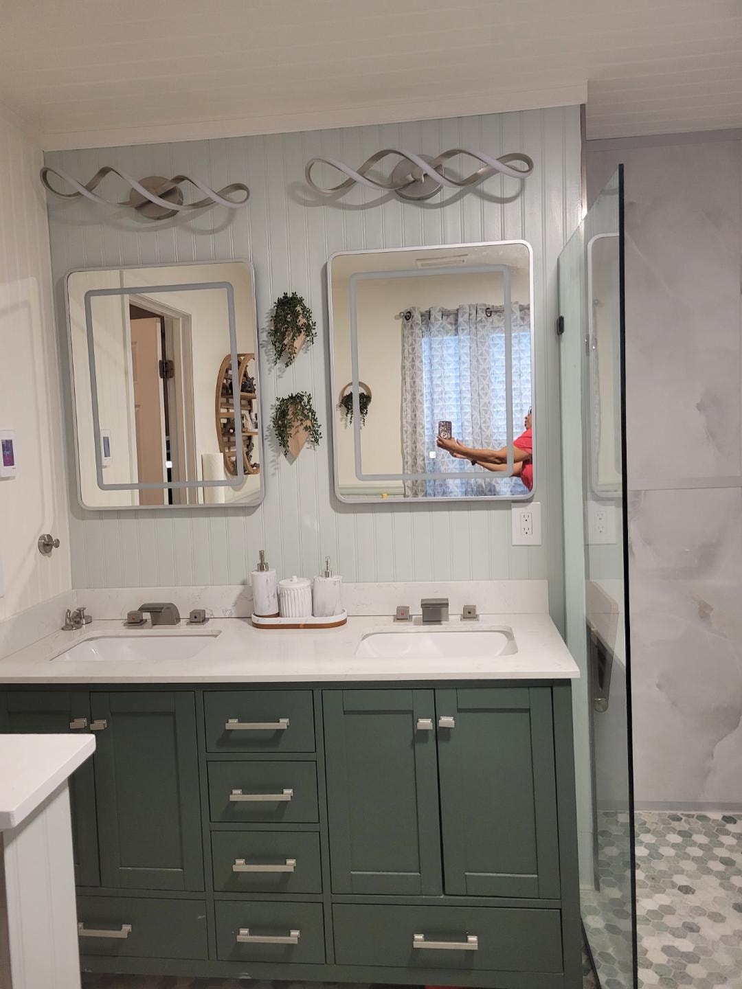 Bathroom renovation — double vanity with green cabinetry