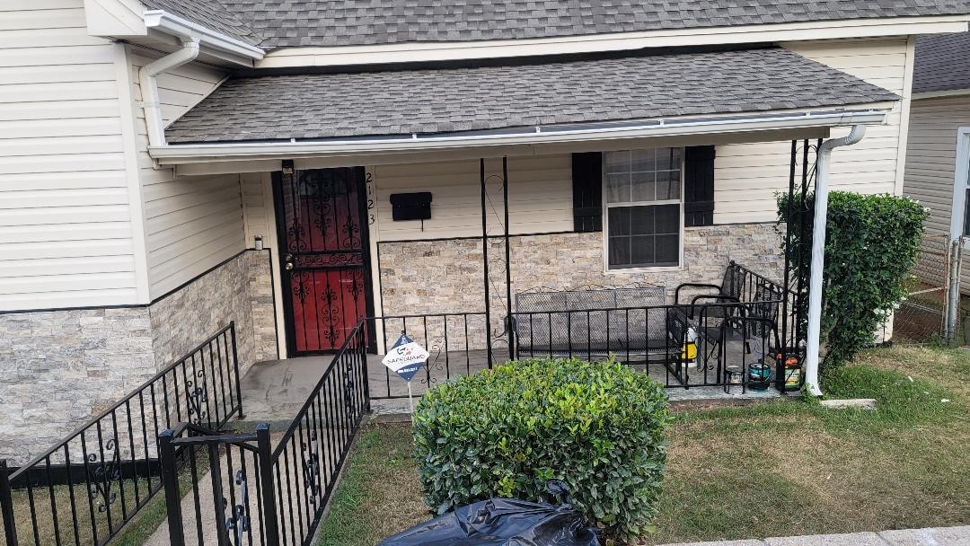 Exterior siding repair — porch front view