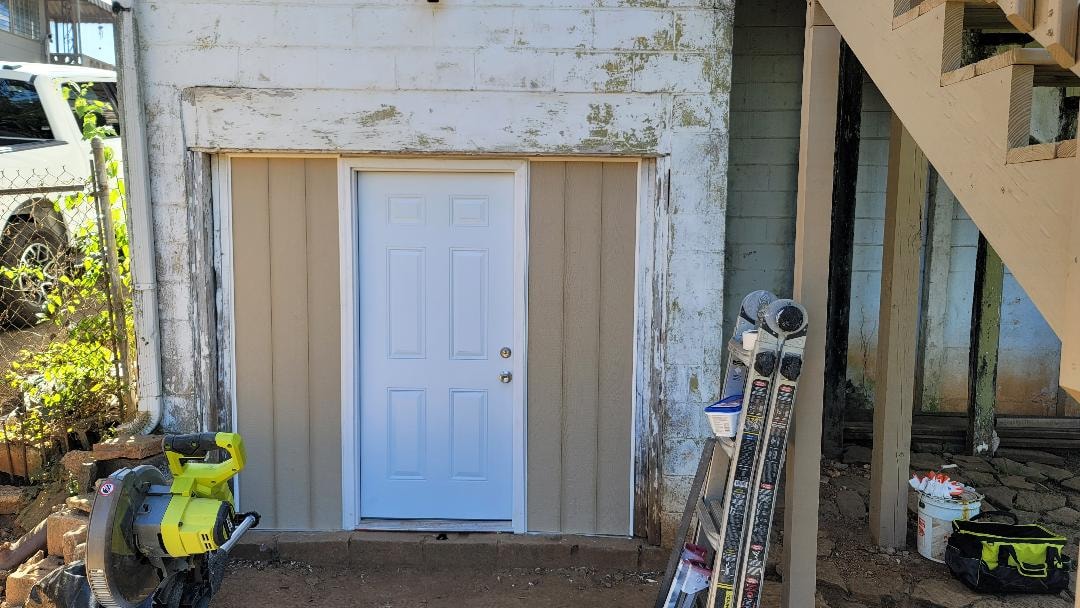Garage door closure — finished door installation with new siding